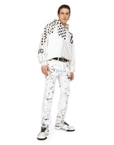 Slim-fit stretch jeans with rips and splash design - | Dolce & Gabbana