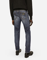 Slim fit washed stretch jeans with subtle abrasions - | Dolce & Gabbana