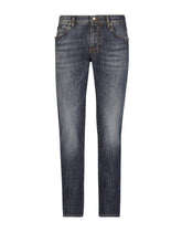 Slim fit washed stretch jeans with subtle abrasions - | Dolce & Gabbana