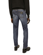 Slim fit washed stretch jeans with subtle abrasions - | Dolce & Gabbana