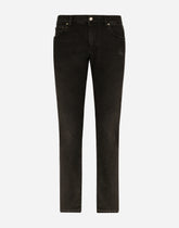 Slim fit stretch denim jeans with subtle abrasions - | Dolce & Gabbana