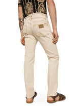 Stretch denim jeans with raw hem details - | Dolce & Gabbana