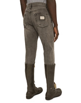 Slim fit stretch denim jeans with subtle abrasions - | Dolce & Gabbana