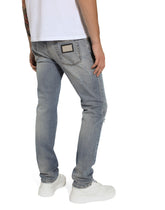 Slim-fit blue stretch denim jeans with abrasions - | Dolce & Gabbana
