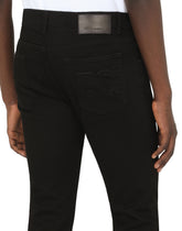 Black slim-fit stretch jeans with DG logo - | Dolce & Gabbana