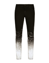 Slim-fit stretch jeans with brushstrokes and DG logo - | Dolce & Gabbana