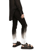 Slim-fit stretch jeans with brushstrokes and DG logo - | Dolce & Gabbana