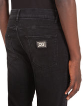 Washed black skinny stretch jeans - | Dolce & Gabbana