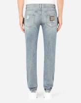 Blue wash skinny stretch jeans with rips - | Dolce & Gabbana