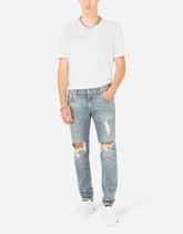 Blue wash skinny stretch jeans with rips - | Dolce & Gabbana