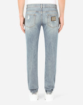 Blue wash skinny stretch jeans with rips - | Dolce & Gabbana
