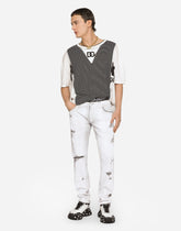 Coated skinny stretch jeans with rips - | Dolce & Gabbana