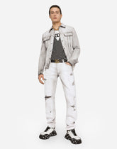 Coated skinny stretch jeans with rips - | Dolce & Gabbana