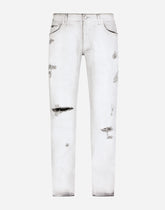 Coated skinny stretch jeans with rips - | Dolce & Gabbana