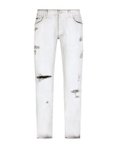 Coated skinny stretch jeans with rips - | Dolce & Gabbana