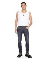 Mid blue skinny stretch jeans with abrasions - | Dolce & Gabbana