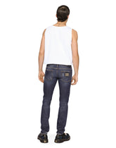 Mid blue skinny stretch jeans with abrasions - | Dolce & Gabbana