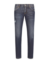 Mid blue skinny stretch jeans with abrasions - | Dolce & Gabbana