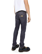 Mid blue skinny stretch jeans with abrasions - | Dolce & Gabbana