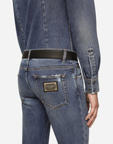 Light blue skinny stretch jeans with rips - | Dolce & Gabbana