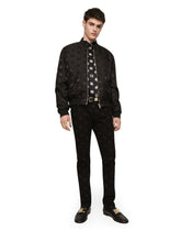 Black skinny jeans with all-over DG logo print - | Dolce & Gabbana
