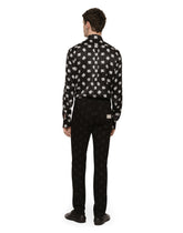 Black skinny jeans with all-over DG logo print - | Dolce & Gabbana