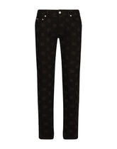 Black skinny jeans with all-over DG logo print - | Dolce & Gabbana