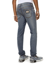 Light blue skinny stretch jeans with whiskering - | Dolce & Gabbana