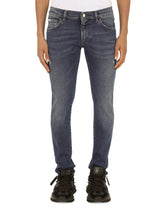 SKINNY STRETCH WASHED JEANS WITH SMALL ABRASIONS - | Dolce & Gabbana
