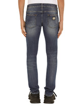 SKINNY STRETCH WASHED JEANS WITH SMALL ABRASIONS - | Dolce & Gabbana