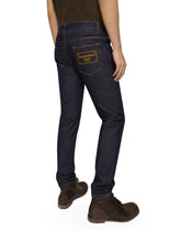 Skinny stretch denim jeans with flocked logo tag - | Dolce & Gabbana