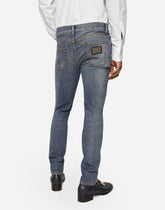 Washed skinny stretch jeans with whiskering - | Dolce & Gabbana