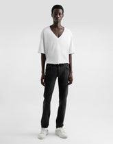Skinny jeans in stretch cotton with plaque - | Dolce & Gabbana