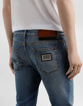 Skinny stretch cotton jeans with tag - | Dolce & Gabbana
