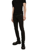 Washed black skinny stretch jeans with DG logo - | Dolce & Gabbana