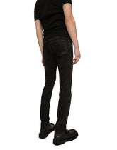 Washed black skinny stretch jeans with DG logo - | Dolce & Gabbana
