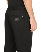 Stretch cotton jogging pants with tag - | Dolce & Gabbana