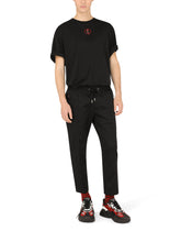 Stretch cotton jogging pants with tag - | Dolce & Gabbana