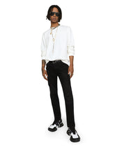 Black skinny stretch jeans with repaired rips - | Dolce & Gabbana