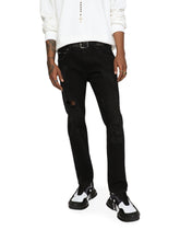 Black skinny stretch jeans with repaired rips - | Dolce & Gabbana
