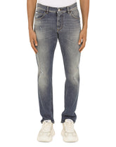 STRETCH DENIM REGULAR JEANS WITH RIPS - | Dolce & Gabbana