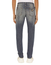 STRETCH DENIM REGULAR JEANS WITH RIPS - | Dolce & Gabbana