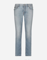 Regular fit washed stretch denim jeans with abrasions - | Dolce & Gabbana