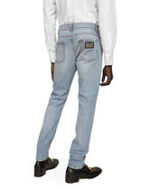 Regular fit washed stretch denim jeans with abrasions - | Dolce & Gabbana