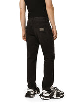 Loose black wash jeans with rips - | Dolce & Gabbana