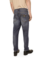 Loose fit washed stretch jeans with subtle abrasions - | Dolce & Gabbana