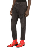 Loose black wash jeans with rips and DG patch - | Dolce & Gabbana