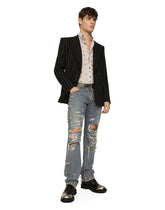 Washed denim jeans with studs and rips - | Dolce & Gabbana