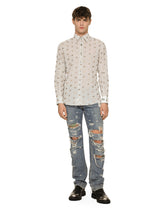 Washed denim jeans with studs and rips - | Dolce & Gabbana
