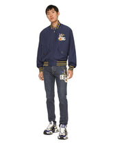Slim-fit stretch denim jeans with DG patch - | Dolce & Gabbana